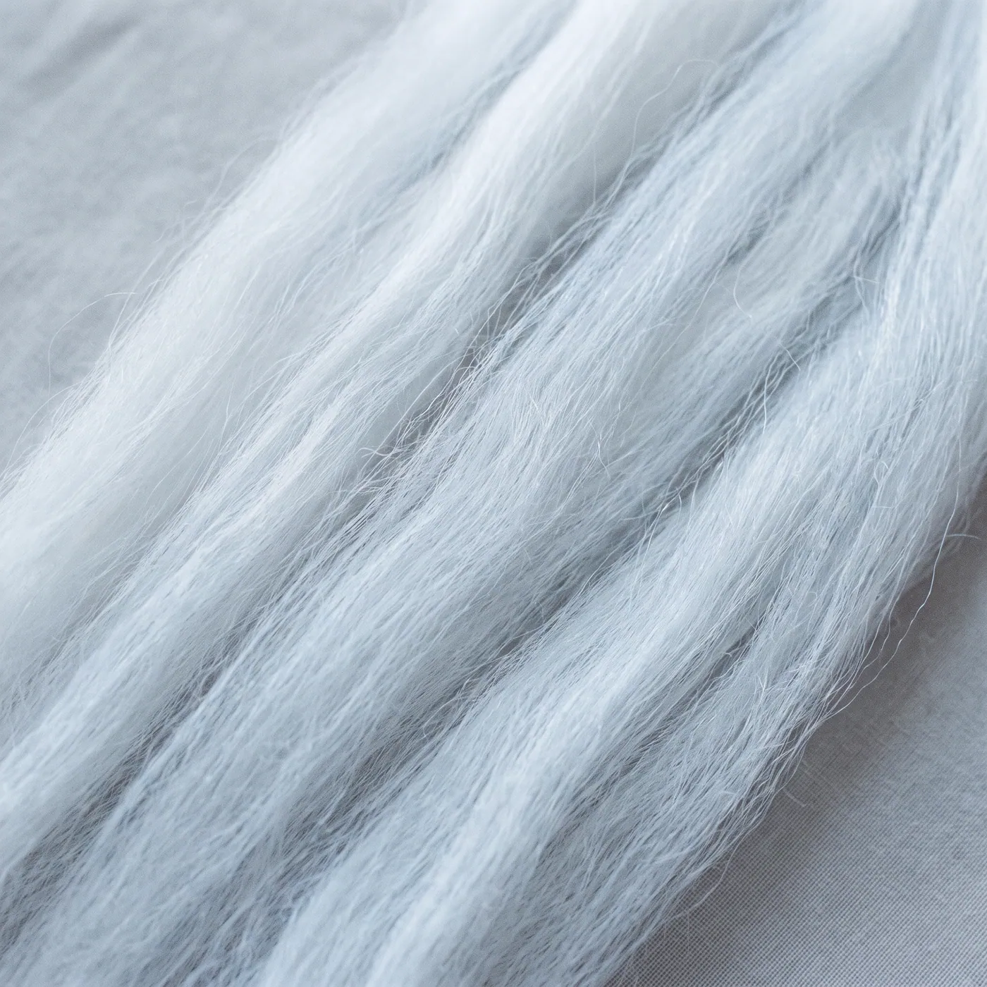 Close-up of fine, combed white polyester fiber